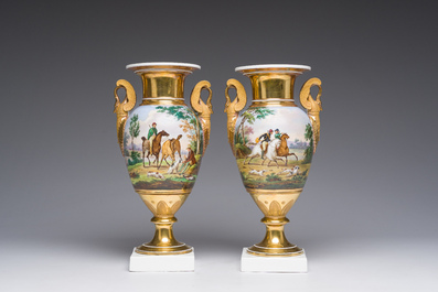A pair of Brussels porcelain Empire vases with hunting parties, Chappel and Panneel, first half 19th C.
