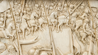 A museal and impressive carved ivory relief depicting a battle from the Hundred Years' War, probably Dieppe, 19th C.