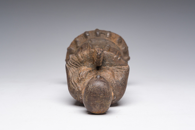 A Chinese cast iron sculpture of a Luohan, probably Ming