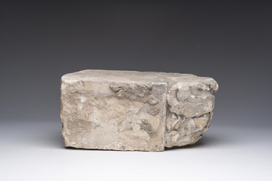A Romanesque carved stone corbel with a grotesque head, probably France, 14th/15th C.