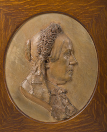 Belgian school: A pair of terracotta patinated plaster portrait reliefs of Arthur Belpaire and his wife, dated 1870