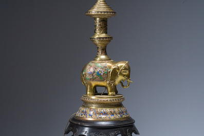 A reticulated Chinese wooden stand with marble top and a French gilt brass and champlev&eacute; 'elephant' lamp, 20th C.
