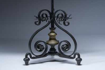 A gilt copper firescreen depicting Marie de' Medici on a wrought iron base, 19th C.