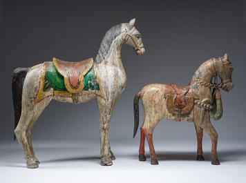 Two Indian polychrome decorated and patinated wooden horses, 20th C.