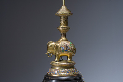 A reticulated Chinese wooden stand with marble top and a French gilt brass and champlev&eacute; 'elephant' lamp, 20th C.