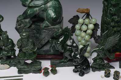 Sixteen Chinese green jade and hardstone sculptures, 20th C.