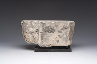A Romanesque carved stone corbel with a grotesque head, probably France, 14th/15th C.