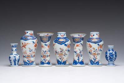 A Chinese Imari style five-piece miniature garniture and two blue and white vases with floral design, Kangxi