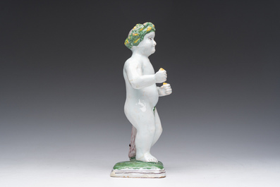 A polychrome Brussels faience allegorical sculpture depicting one of the four seasons, 19th C.