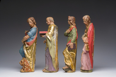 Four polychrome decorated wooden 'evangelist' sculptures, 19th C.