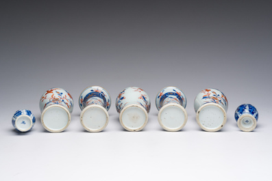 A Chinese Imari style five-piece miniature garniture and two blue and white vases with floral design, Kangxi