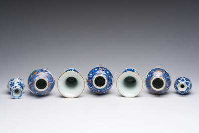 A Chinese Imari style five-piece miniature garniture and two blue and white vases with floral design, Kangxi