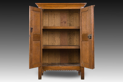 A Flemish oak two door cupboard with cast iron hinges, 17th C.