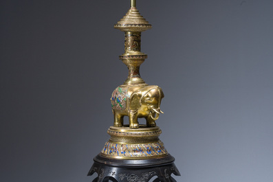 A reticulated Chinese wooden stand with marble top and a French gilt brass and champlev&eacute; 'elephant' lamp, 20th C.