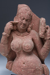 An Indian yellow-speckled red sandstone relief of a devata, probably Mathura school, Kushan period 2nd C. b.C./2nd C.
