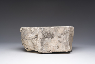 A Romanesque carved stone corbel with a grotesque head, probably France, 14th/15th C.