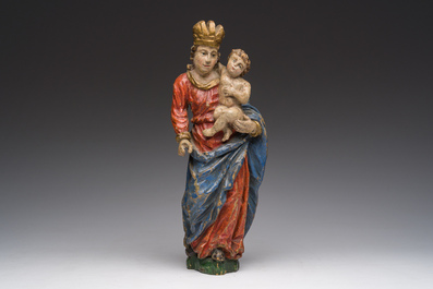 A Flemish polychromed wooden sculpture of The Madonna with Child, 18th C.