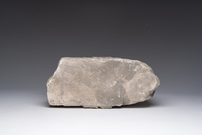 A Romanesque carved stone corbel with a grotesque head, probably France, 14th/15th C.