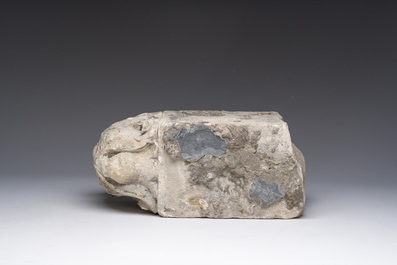 A Romanesque carved stone corbel with a grotesque head, probably France, 14th/15th C.