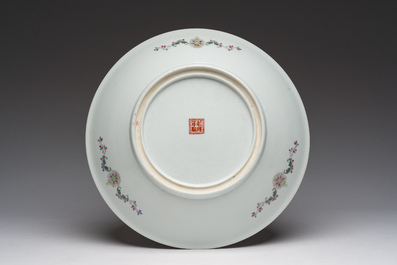 A Chinese famille rose dish with ladies relaxing in a palace garden, Qianlong mark, 20th C.