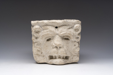 An architectural limestone fragment with a lion's head, probably 16th C.