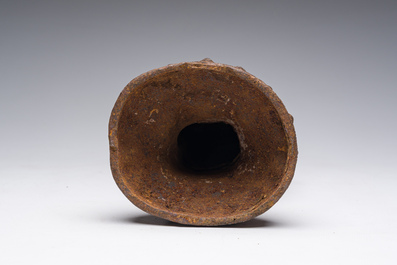 A Chinese cast iron sculpture of a Luohan, probably Ming