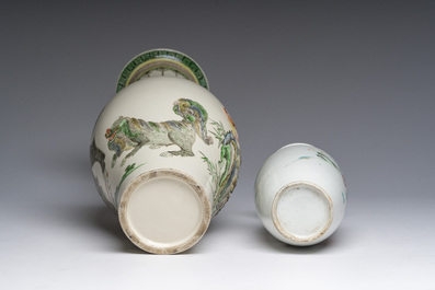 A Chinese rose-verte vase with Buddhist lions and applied floral design and a famille rose vase, 19th C.