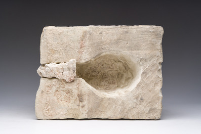 An architectural limestone fragment with a lion's head, probably 16th C.