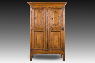 A Flemish oak two door cupboard with cast iron hinges, 17th C.