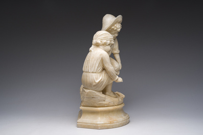 Italian school, attributed to Adolfo Cipriani (1857-1941): Two children warming themselves by the fire, alabaster, 20th C.