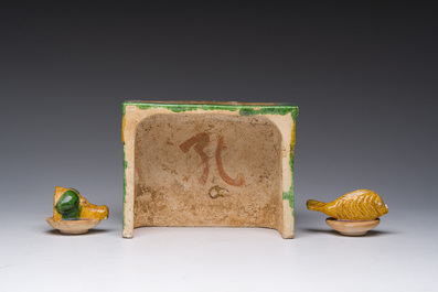 A Chinese sancai glazed miniature offering table with a fish and a pig's head, probably Ming