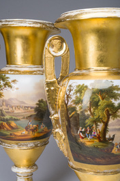 A pair of fine gilt and polychrome Paris porcelain 'animated landscapes' Empire vases, first half 19th C.