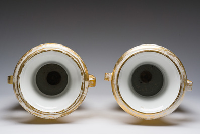A pair of fine gilt and polychrome Paris porcelain 'animated landscapes' Empire vases, first half 19th C.