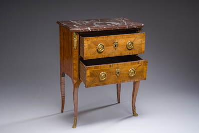 Jacques-Pierre Letellier (ca.1745-?): A mahogany veneer Louis XVI chest of drawers with gilt bronze mounts and red marble top
