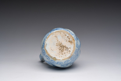 A twisted blue and white Dutch Delft chinoiserie jug, 17th C.