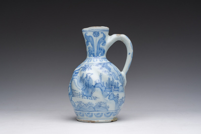 A twisted blue and white Dutch Delft chinoiserie jug, 17th C.