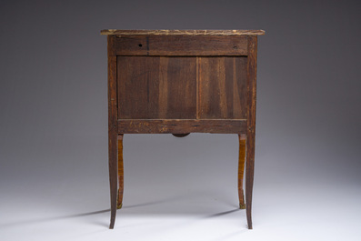 Jacques-Pierre Letellier (ca.1745-?): A mahogany veneer Louis XVI chest of drawers with gilt bronze mounts and red marble top