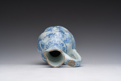A twisted blue and white Dutch Delft chinoiserie jug, 17th C.