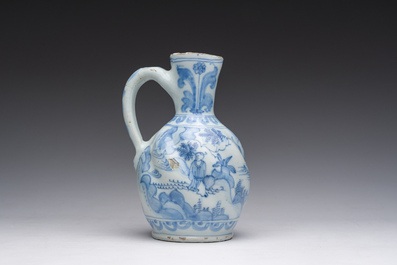 A twisted blue and white Dutch Delft chinoiserie jug, 17th C.