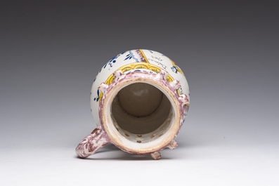 A polychrome French faience puzzle jug with Saint Peter, dated 1762, France, 19th C.