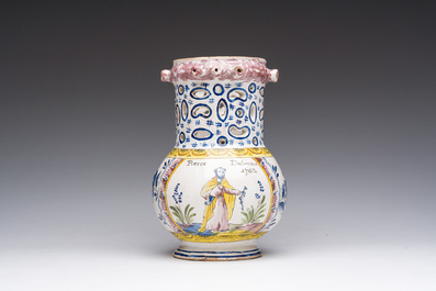 A polychrome French faience puzzle jug with Saint Peter, dated 1762, France, 19th C.