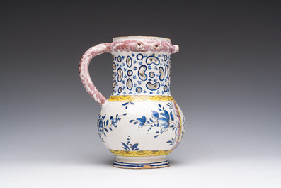 A polychrome French faience puzzle jug with Saint Peter, dated 1762, France, 19th C.