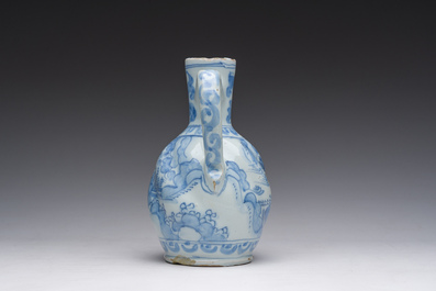 A twisted blue and white Dutch Delft chinoiserie jug, 17th C.