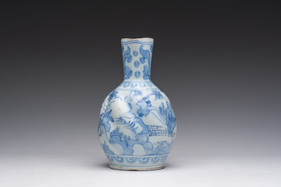 A twisted blue and white Dutch Delft chinoiserie jug, 17th C.