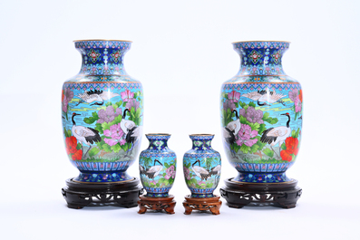 Two pairs of Chinese cloisonn&eacute; vases with cranes among blossoming branches, 20th C.