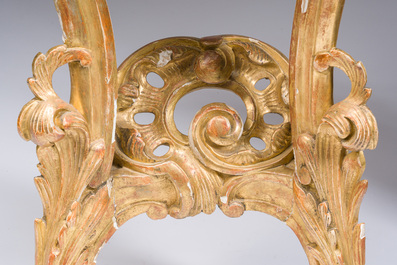 A pair of French carved gilt wooden Louis XV consoles with marble tops, 18th C.