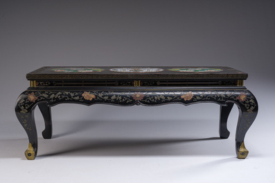 A Chinese rectangular lacquered wooden table with three cloisonn&eacute; plaques, 20th C.