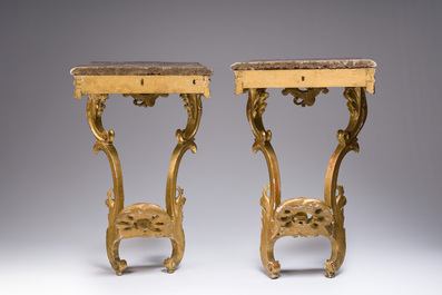 A pair of French carved gilt wooden Louis XV consoles with marble tops, 18th C.