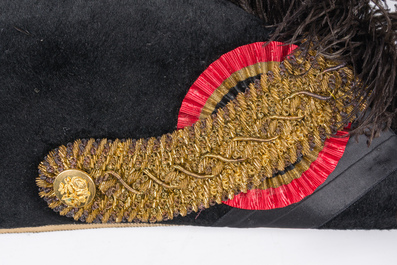 Two Belgian ceremonial costumes with bicorn hats and sables, 19th/20th C.