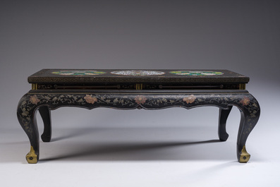 A Chinese rectangular lacquered wooden table with three cloisonn&eacute; plaques, 20th C.